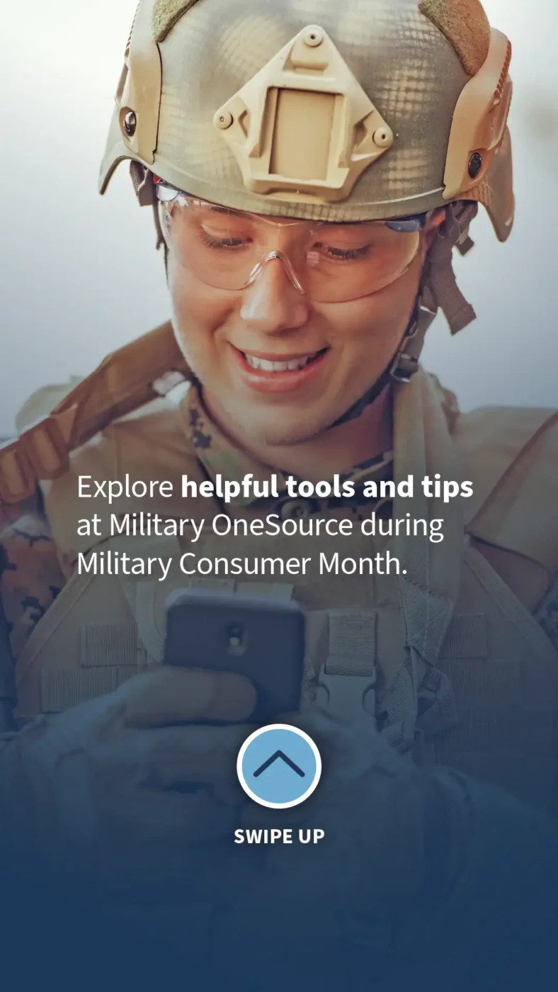 Female dressed in military gear looking down while exploring her phone.